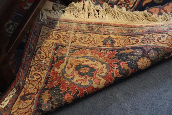 A Kirman red ground carpet, 14ft 1in by 10ft 10in.
